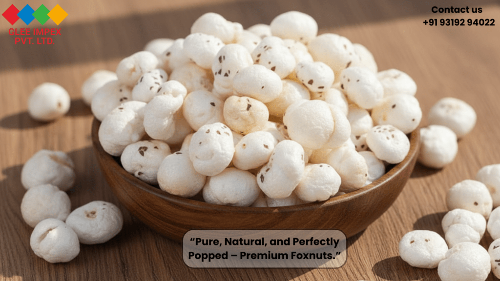 A close-up of high-quality, perfectly popped white Makhana in a wooden bowl from a premium foxnut exporter India.