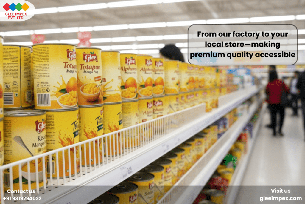 The Global Gold Standard: Why Glee Impex is the Preferred Organic Mango Pulp Exporter for Premium Food Brands Long rows of Glee brand Totapuri and Alphonso mango pulp cans displayed on a bright supermarket shelf, demonstrating the global reach of a premium organic mango pulp exporter.